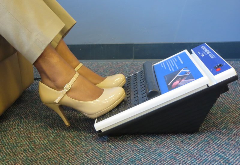 Woman in office using HeartPartner device