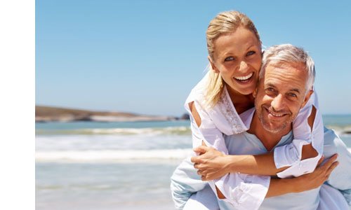 Older couple with woman riding piggyback