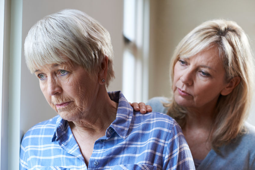 Senior woman with adult daughter at home